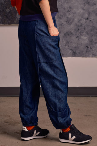 Side view of model wearing denim Finely Pants by Jennifer Glasgow. 