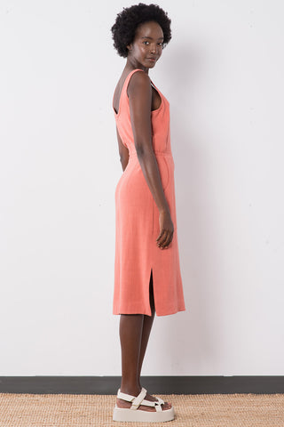 Side view of model wearing terra cotta linen blend Aisha Dress by Jennifer Glasgow. 