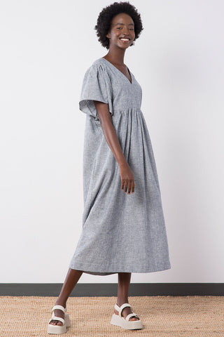 Model wearing OEKO-TEK organic cotton / hemp blend navy denim stripe oversized Ayla Maxi Dress by Jennifer Glasgow. 