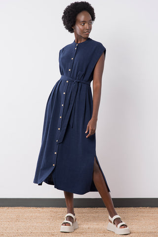 Model wearing navy linen blend button up Helena Dress by Jennifer Glasgow. 