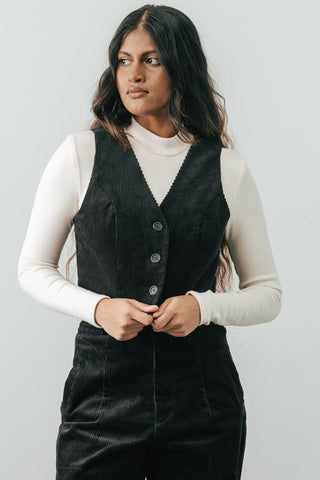 Model wearing black organic corduroy Omura Vest by Jennifer Glasgow. 