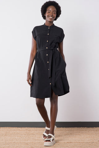 Model wears black linen blend belted button up Wren Dress by Jennifer Glasgow. 