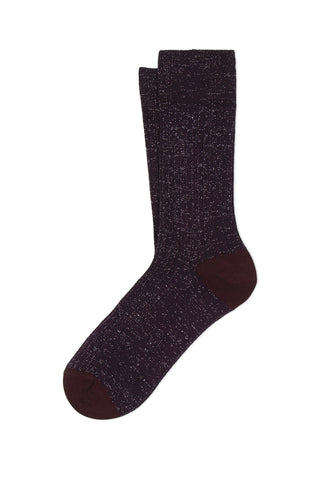 A pair of burgundy lurex ribbed knit socks on white background. 