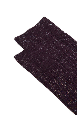 Close-up of a pair of burgundy lurex rib knit socks on white background. 