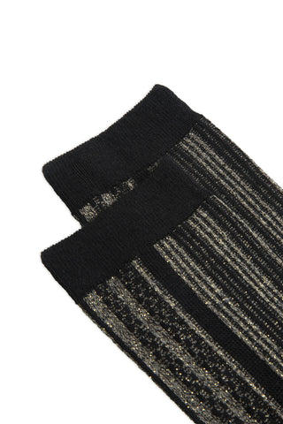 Close-up of a pair of black and silver stripe pattern socks. 