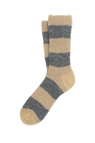 A pair of taupe and grey stripe ribbed knit crew length sock against a white background. 