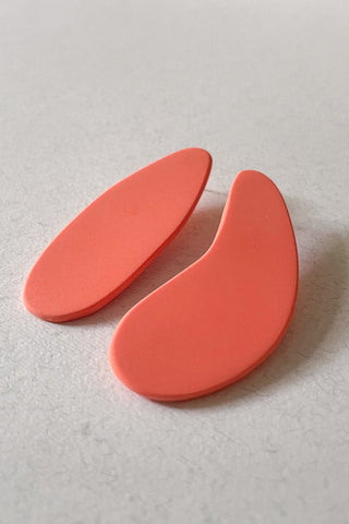 Coral pink polymer clay Ese X Apa earrings by Ade Studio. 