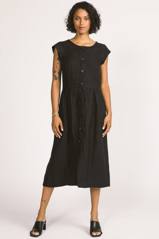Woman wearing black linen button up linen Blythe dress by Allison Wonderland. 