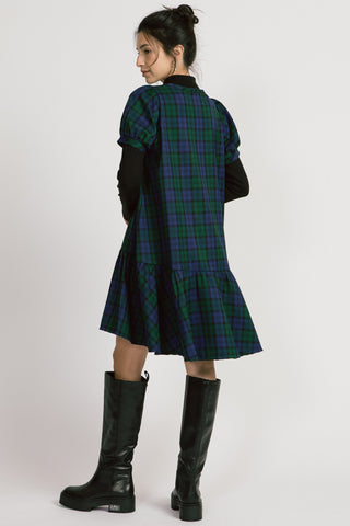 Back view of model wearing green and blue plaid puff sleeve Bronwyn Dress by Allison Wonderland. 