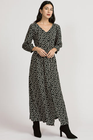 Model wearing black polka dot ankle length long sleeve Jezebel Dress by Allison Wonderland.  