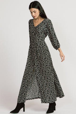 Model wearing black polka dot ankle length long sleeve Jezebel Dress by Allison Wonderland.  