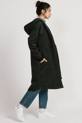 Side view of model wearing dark grey zip up Lenora Coat by Allison Wonderland. 
