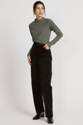 Model wearing fine black corduroy Lydia pants by Allison Wonderland. 