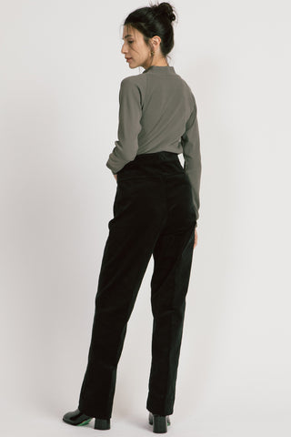 Back view of model wearing fine black corduroy Lydia pants by Allison Wonderland. 