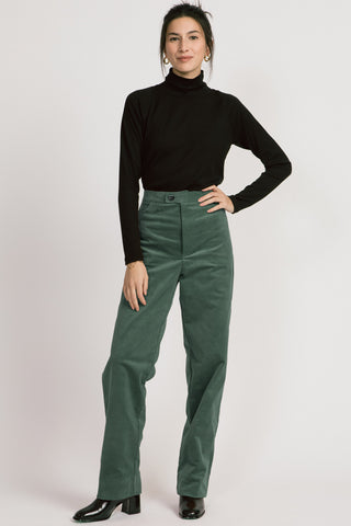 Model wearing fine green corduroy Lydia pants by Allison Wonderland. 