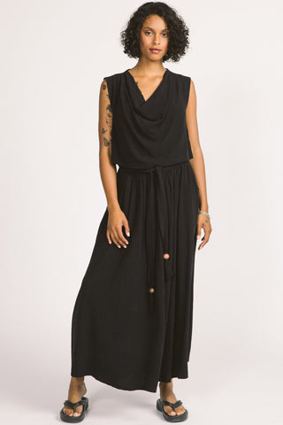 Woman wearing black drape top and black maxi length Oriana Skirt by Allison Wonderland. 