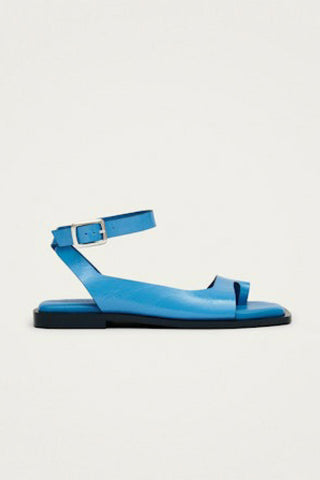 Bright blue leather toe ring sandal with ankle strap. 