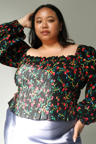 Model wearing rosebud print Yaa Top by Batik Boutik.
