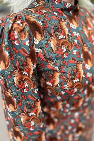 Close-up of squirrel and strawberry print fabric. 