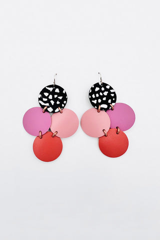 Recycled leather earrings with Black, pink, purple and orange circles. 