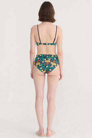 Back view of woman wearing navy floral print bikini. 