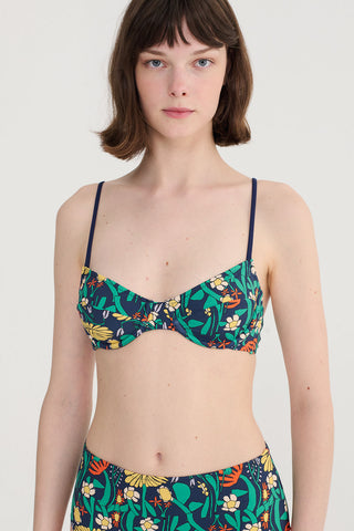 Woman wearing navy floral print bikini. 