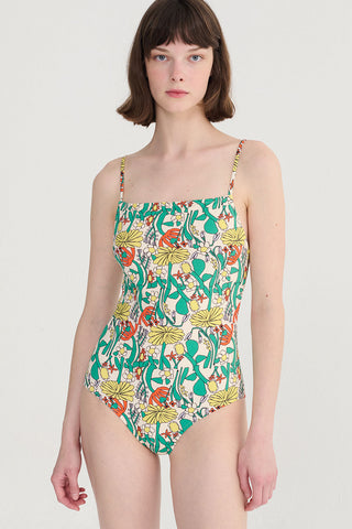 Woman wearing multi-colour floral print swimsuit. 