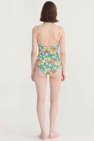Back view of a woman wearing multi-colour floral print swimsuit. 