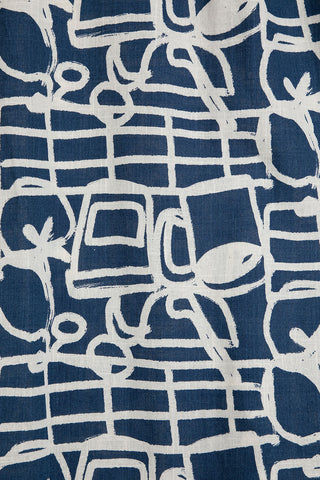 Close-up of navy and cream print fabric. 