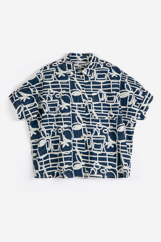 Navy blue and cream abstract print button up shirt on white background.
