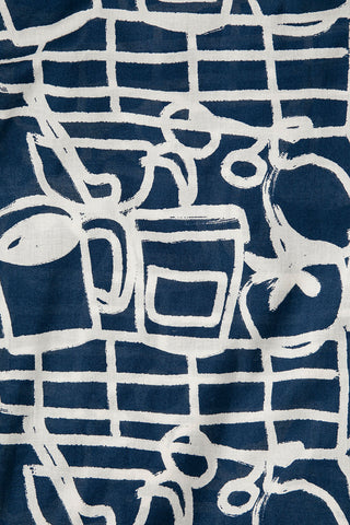Close-up of navy and cream abstract print fabric. 