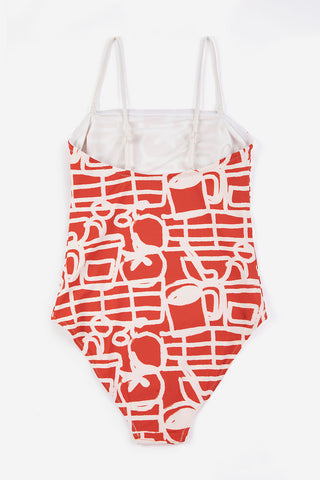 Back of red and cream printed one-piece swimsuit on white background. 