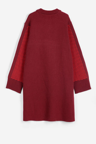A long-sleeve knit sweater dress in deep burgundy red, featuring contrasting red and burgundy striped knit sleeves, shown from the back against a plain white background.