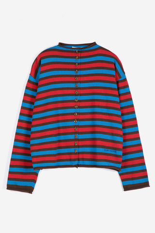 A long-sleeve knit cardigan with horizontal stripes in red, blue, and black featuring raw edge rolled up edges. 
