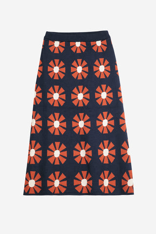 Flat lay photo of navy and red retro geometric floral pattern knit skirt by Bobo Choses. 