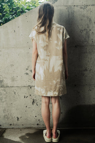 Back view of a woman wearing OEKO-TEX certified linen blend shift Maya dress by Bodybag. 