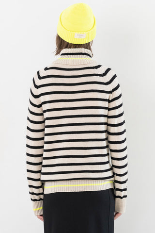 Back of model wearing black and white stripe Merino wool Celebration Sweater by Bodybag. 