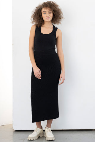 Model wearing slim fit black midi Smith Skirt by Bodybag. 