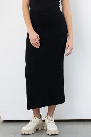 Model wearing slim fit black midi Smith Skirt by Bodybag.