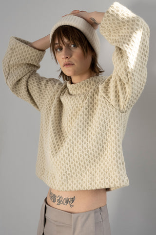 Model wearing cream coloured textured bell sleeve Waters top by Bodybag. 