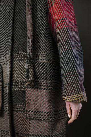 Close-up of navy and red plaid zip up Morrison Coat by BodyBag. 