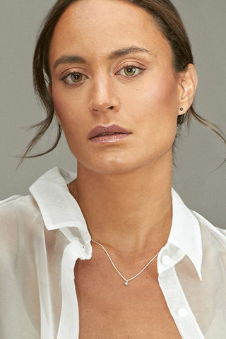 Model wearing sterling silver Spark Necklace by Camillette. 