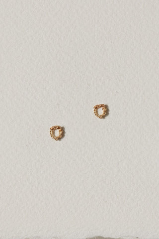 Gold chain sculpted stud earrings by Camillette. 