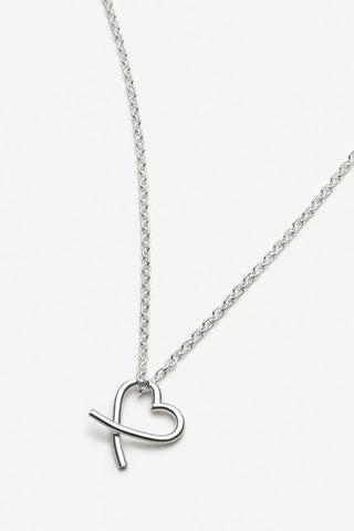 Small silver heart pendant on fine chain.
