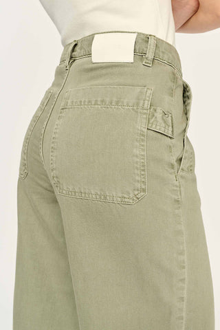 Close-up of soft green Alpine wash wide leg Zoie jeans by DL1961.