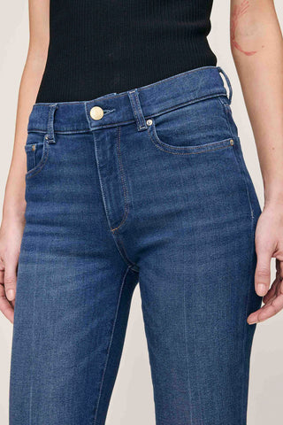 Close-up of waist line of woman wearing mid-rise straight leg Mara Jeans in Santa Monica Wash by DL1961. 