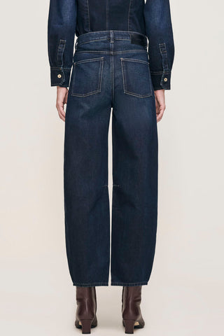 Back view of model wearing Ventura dark wash high rise barrel leg Miro Jeans by DL1961. 