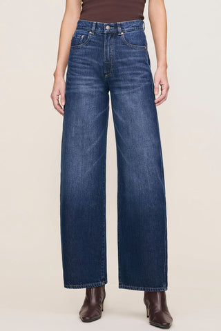 Model wearing a relaxed fit barrel leg Taylor jeans by DL1961. 