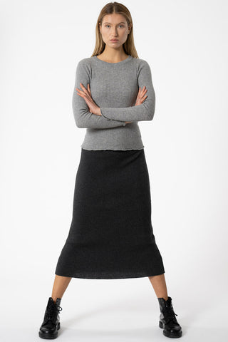 Model wearing fitted ribbed merino skirt by Dinadi. 
