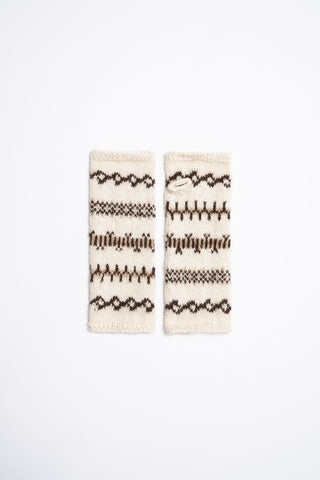 Flat lay photo on white background of ivory and brown fingerless alpaca wool gloves by Dinadi. 